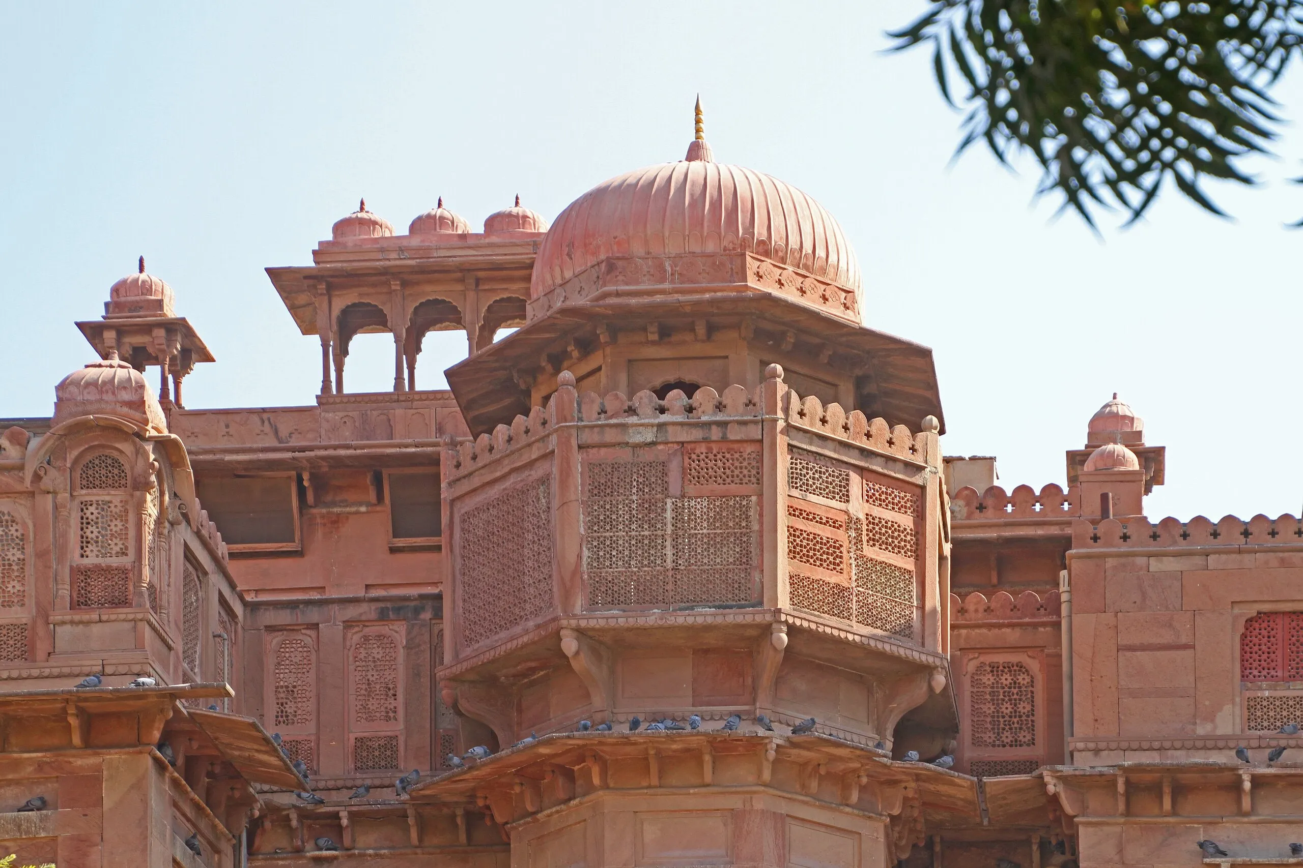 Octagonal jharokha balcony with fine jaali stone screens and a ribbed dome on Junagarh Fort, Bikaner, in pink sandstone