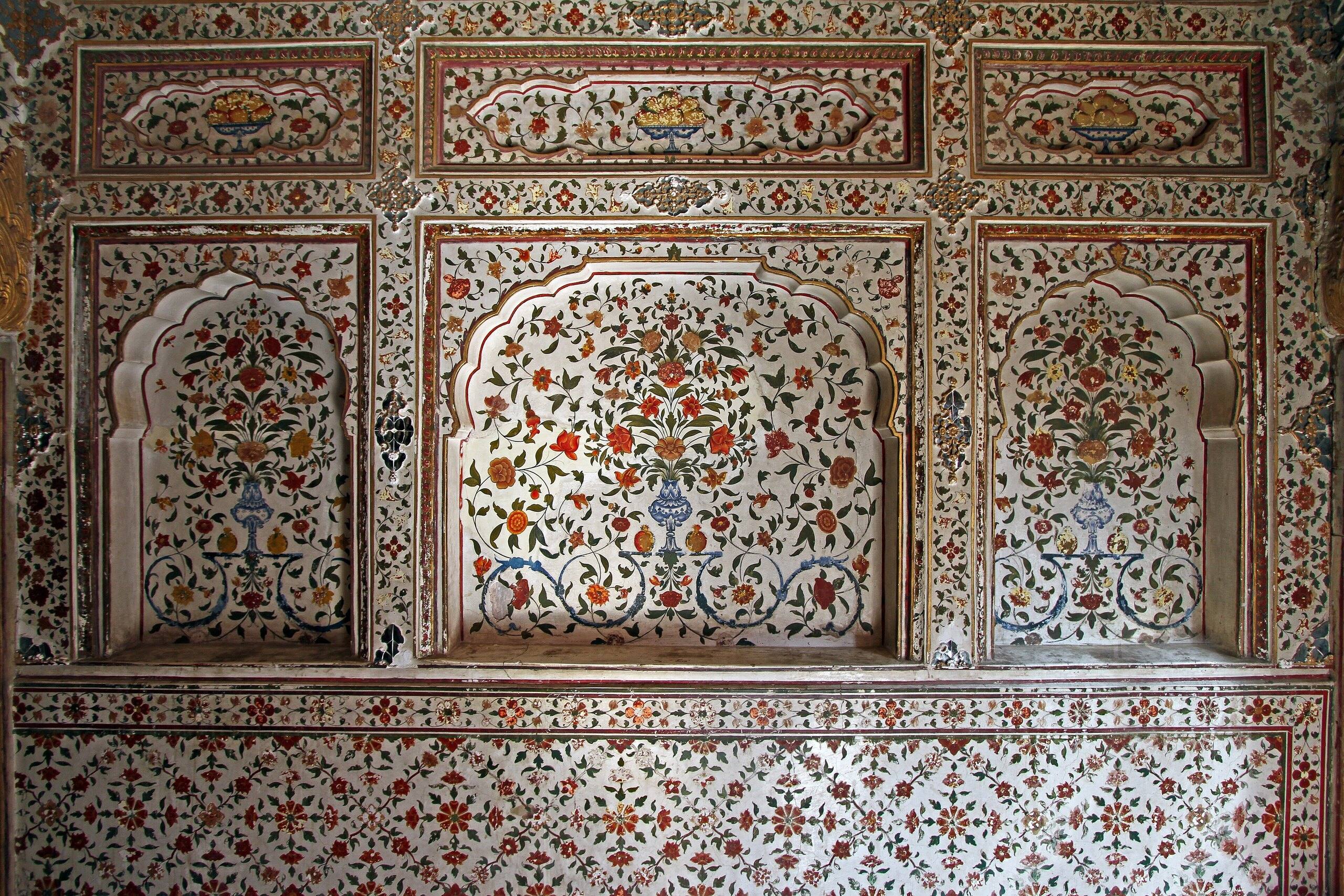 Painted floral niches and ornamented wall panels with vases and fruit bowls inside Junagarh Fort, Bikaner